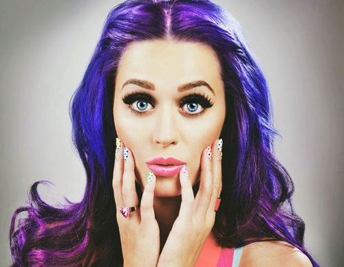 bold vibrant purple hair and polka-dotted nails